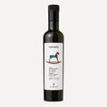A dark glass bottle of Viragi's Carusia organic extra virgin olive oil, featuring a white label with a colorful rocking horse logo and a black cap, set against a light gray background.