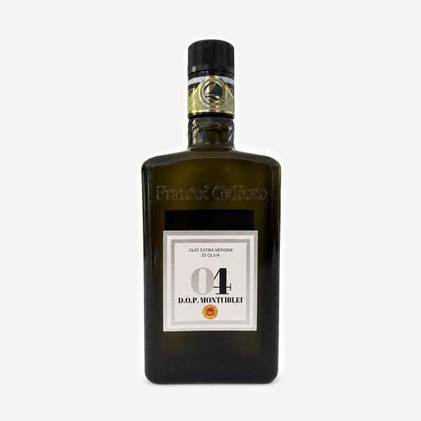 A dark olive-green glass bottle of D.O.P Monti Iblei 04 by Frantoio Galioto