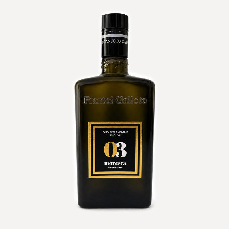 A dark olive-green glass bottle of Frantoio Galioto Moresca Extra Virgin Olive Oil, featuring a black cap and a black label with gold borders and white text.